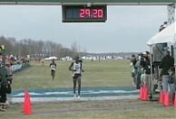 Sam Chelanga crosses the line