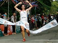 Kilian breaks the tape at Kinabalu