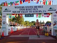 Olson strolls across the WS100 line for a new course record