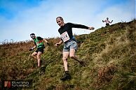Ian Holmes runs side by side with Matt Roberts